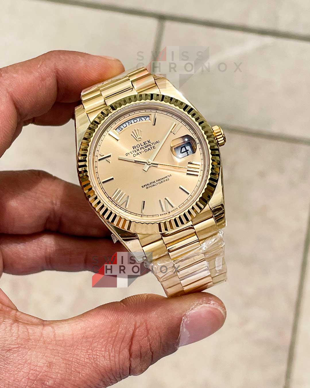 rolex 228238 day date 40 yellow gold champagne dial