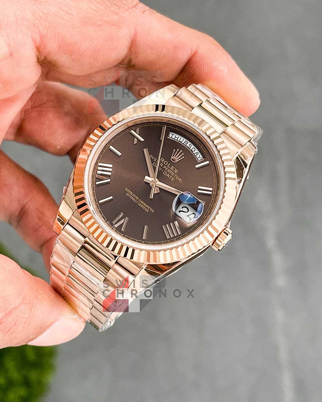 rolex day date 40 chocolate roman dial 7