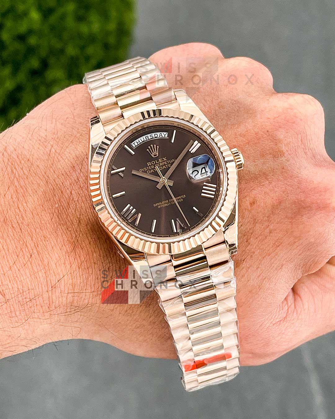 rolex day date 40 chocolate roman dial 9