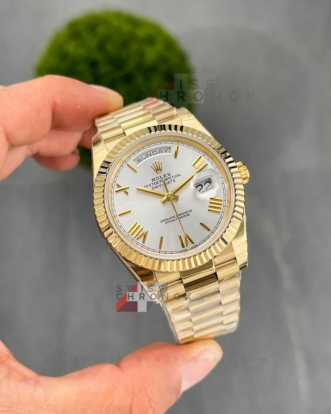 rolex day date 40 yellow gold silver dial 228238