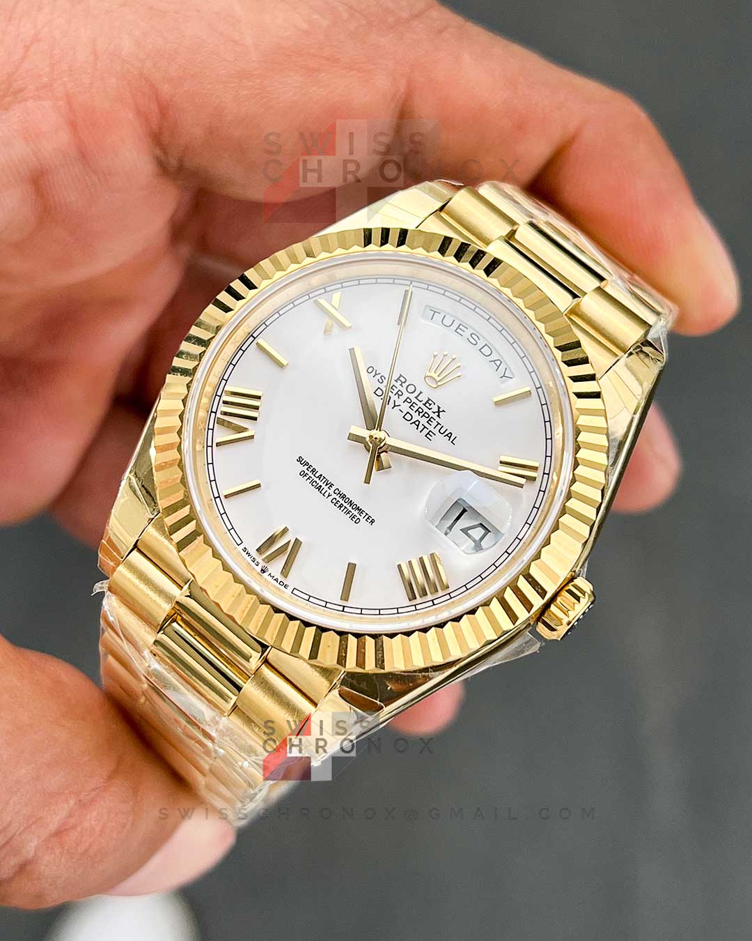rolex day date 40 yellow gold white roman dial 228238 1