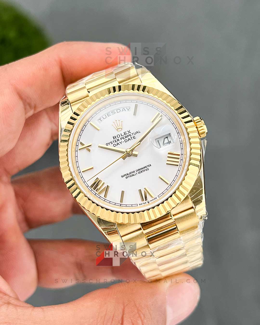 rolex day date 40 yellow gold white roman dial 228238 2