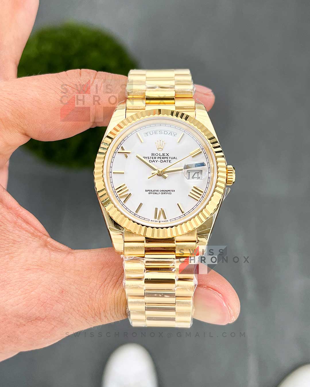 rolex day date 40 yellow gold white roman dial 228238 4