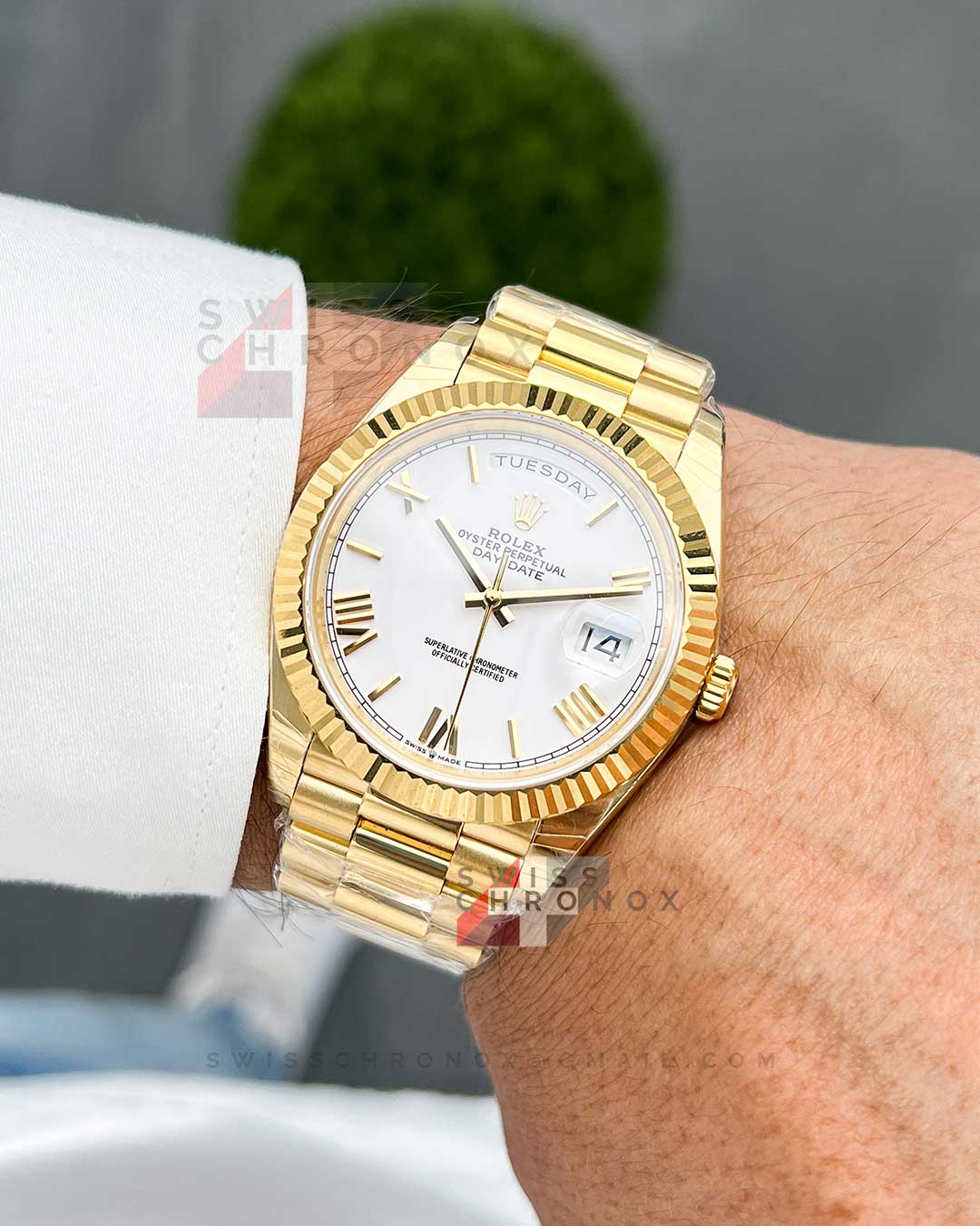 rolex day date 40 yellow gold white roman dial 228238 7